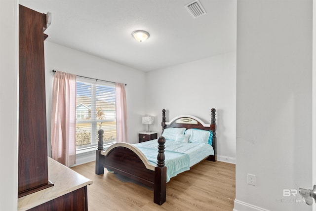 bedroom with light wood-type flooring