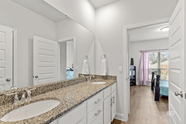 bathroom featuring hardwood / wood-style flooring and vanity