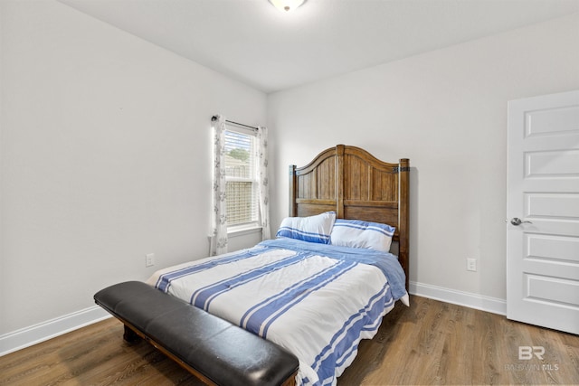 bedroom featuring dark hardwood / wood-style floors