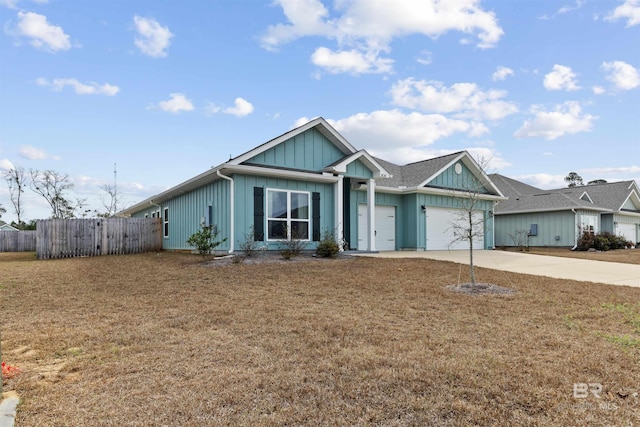 view of front of property with a garage and a front yard