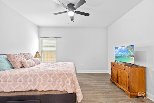 bedroom featuring wood-type flooring and ceiling fan