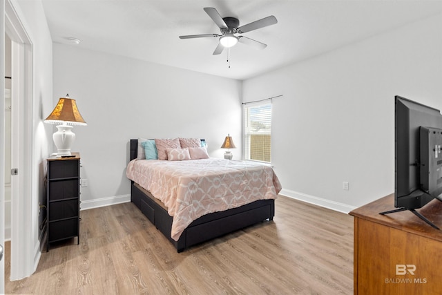 bedroom with ceiling fan and hardwood / wood-style floors