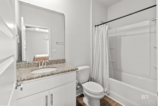 full bathroom with vanity, hardwood / wood-style floors, shower / bath combination with curtain, and toilet