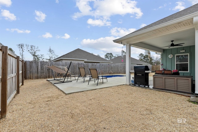 view of yard featuring ceiling fan and a patio area