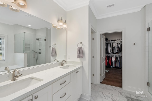 bathroom featuring vanity, crown molding, and a shower with shower door