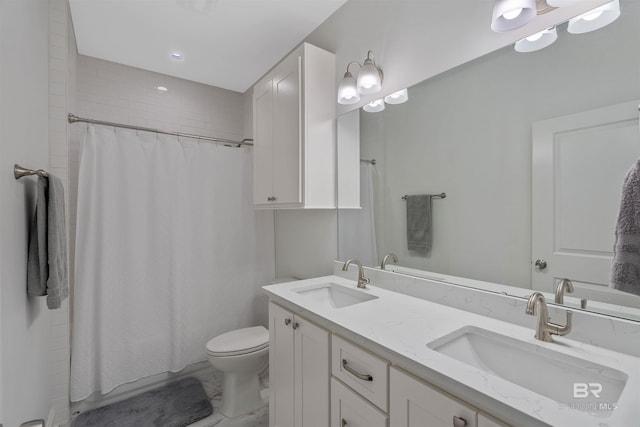 bathroom with vanity, toilet, and a shower with shower curtain