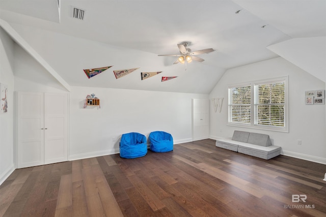 additional living space with ceiling fan, dark hardwood / wood-style floors, and vaulted ceiling