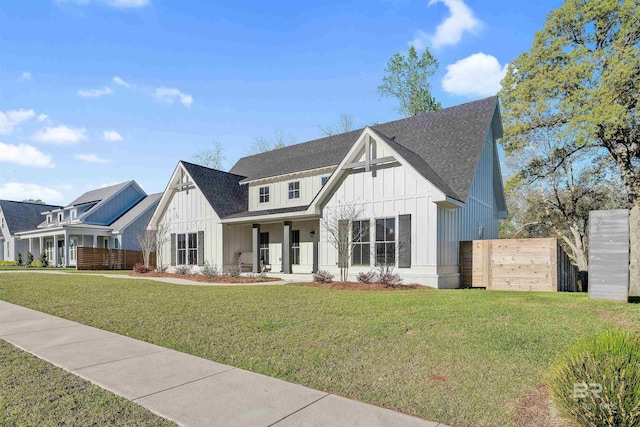 modern farmhouse style home with a front yard