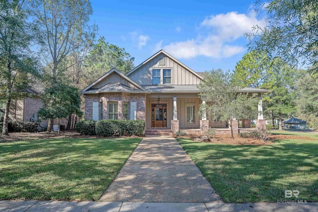 view of front of home featuring a porch and a front lawn