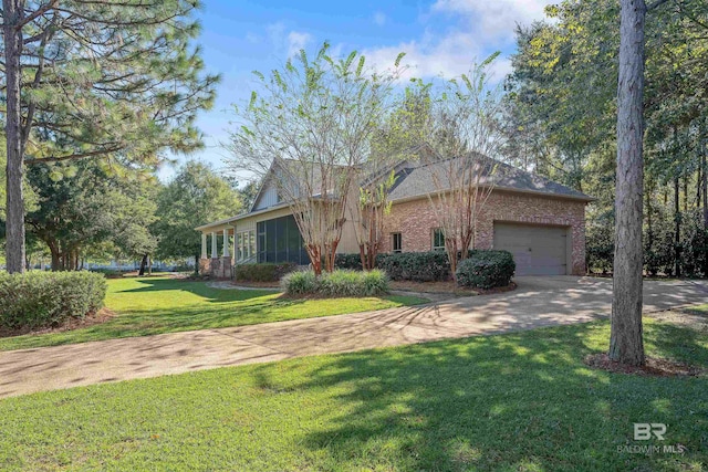 view of front of property featuring a front lawn and a garage