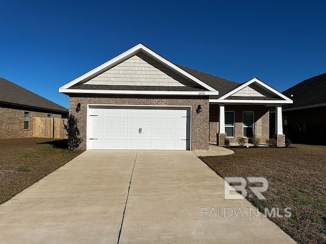 view of front of home with a garage and a front yard