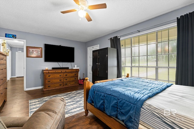 814 Taylor St, Bay Minette, AL 36507 - bedroom featuring wood finished floors, a textured ceiling, ceiling fan, and attic access