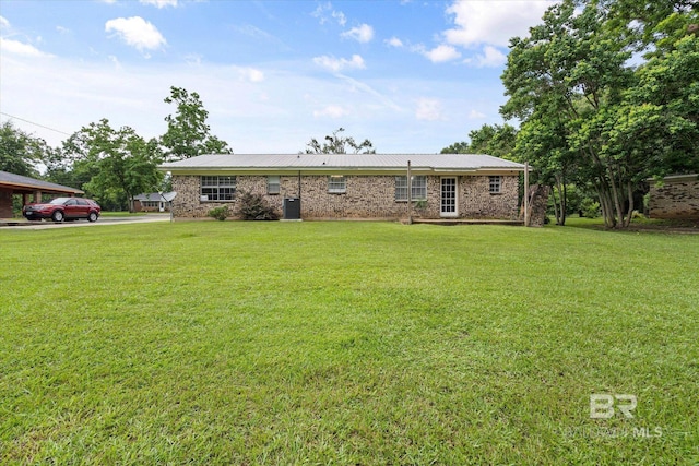 814 Taylor St, Bay Minette, AL 36507 - single story home with a front yard, a metal roof, and brick siding