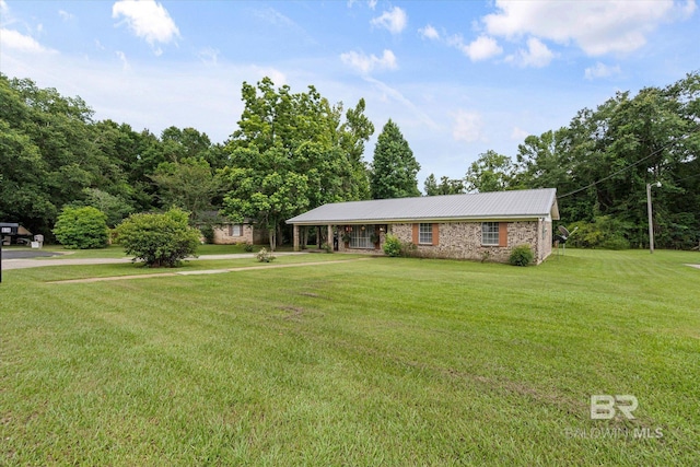 814 Taylor St, Bay Minette, AL 36507 - single story home featuring a front yard and a metal roof