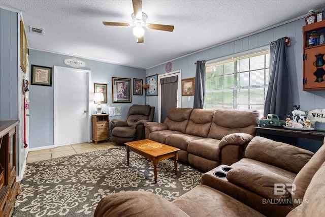 814 Taylor St, Bay Minette, AL 36507 - living area with a ceiling fan, light tile patterned floors, and a textured ceiling