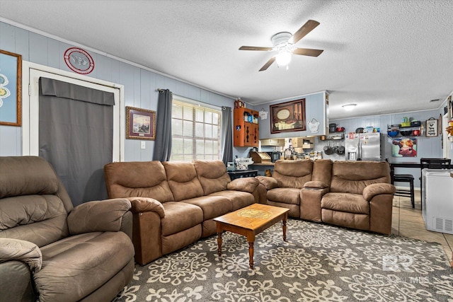814 Taylor St, Bay Minette, AL 36507 - living area with ceiling fan, a textured ceiling, and tile patterned flooring
