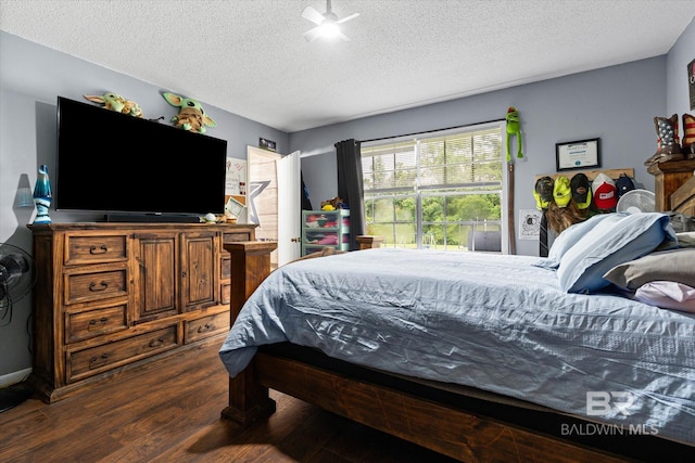 814 Taylor St, Bay Minette, AL 36507 - bedroom with dark wood-style floors and a textured ceiling