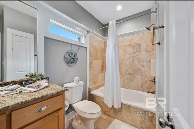 5781 State Highway 180 Unit 5003, Gulf Shores, AL 36542 - bathroom featuring toilet, vanity, and tiled shower / bath