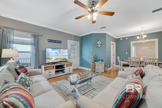 living room with crown molding, light wood-type flooring, and ceiling fan