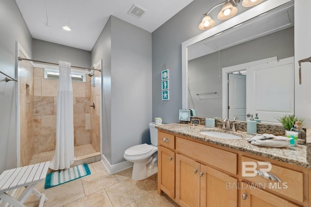 bathroom featuring vanity, toilet, tile patterned floors, and a shower with curtain