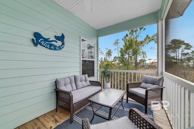 5781 State Highway 180 Unit 5003, Gulf Shores, AL 36542 - wooden terrace with an outdoor hangout area and ceiling fan