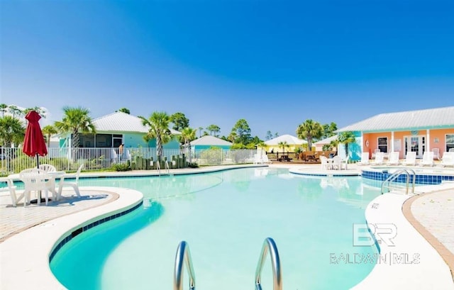 view of pool featuring a patio area