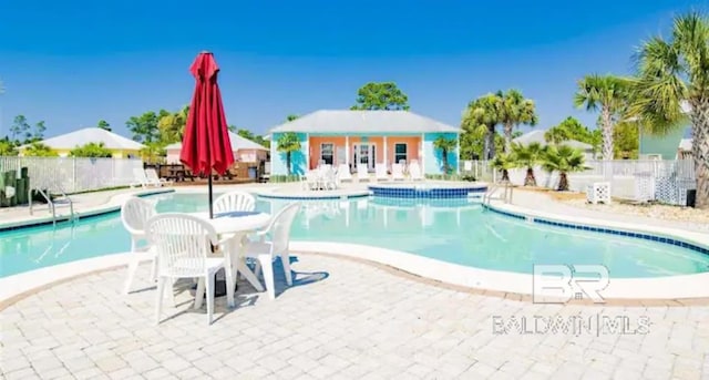 view of swimming pool featuring a patio