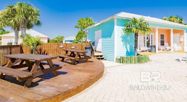 5781 State Highway 180 Unit 5003, Gulf Shores, AL 36542 - rear view of house with outdoor dining area and a wooden deck