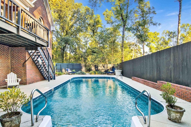 view of swimming pool with a patio