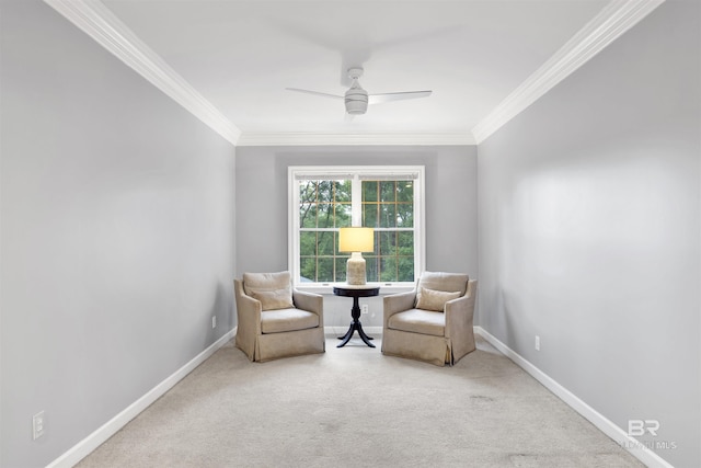 living area with crown molding, carpet, and ceiling fan