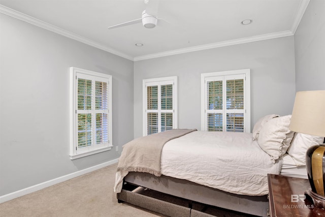 carpeted bedroom featuring ceiling fan, crown molding, and multiple windows