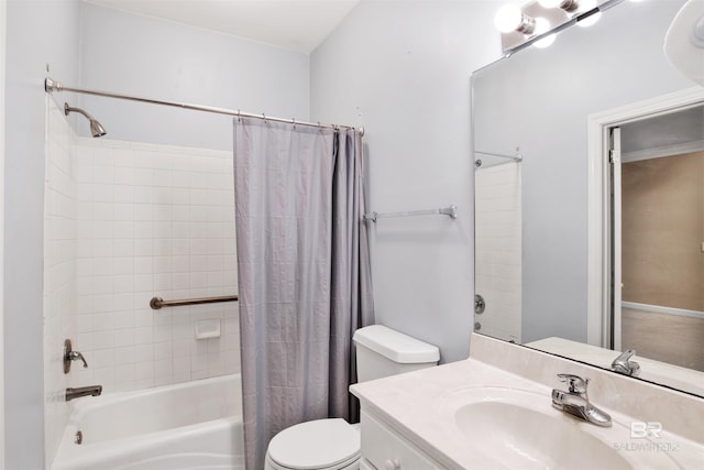 full bathroom featuring vanity, shower / bath combination with curtain, and toilet