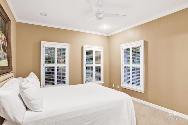 bedroom featuring carpet, ceiling fan, and crown molding