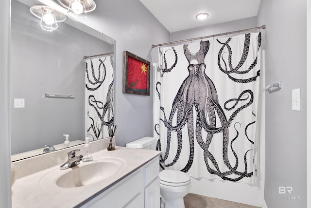 full bathroom featuring shower / bath combo with shower curtain, vanity, and toilet