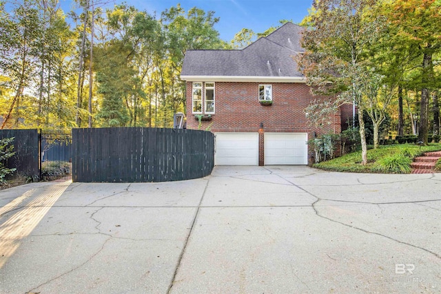 view of side of home with a garage