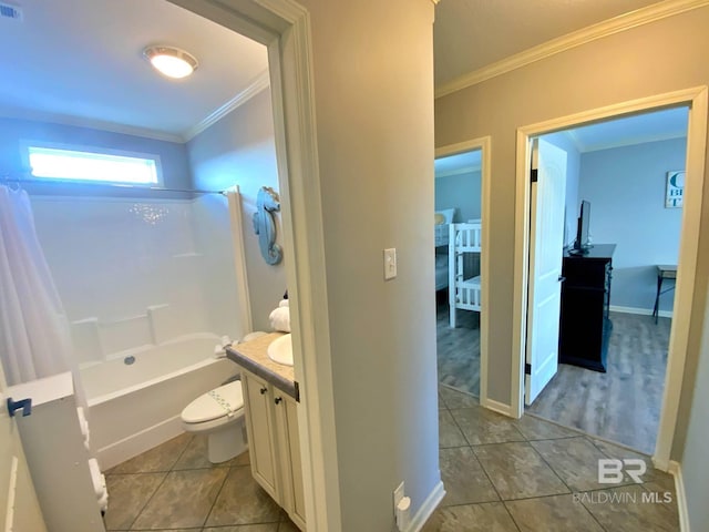 full bath with toilet, vanity, ornamental molding, tile patterned floors, and shower / bathtub combination