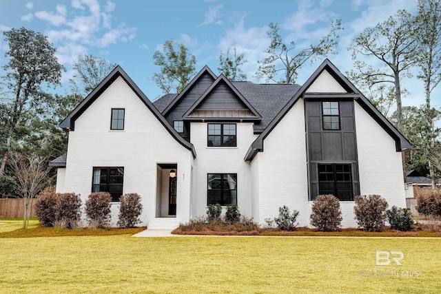 modern farmhouse with a front lawn