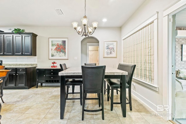 dining room with a chandelier