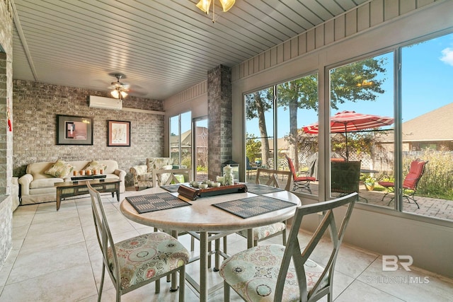 sunroom with ceiling fan, an AC wall unit, and wooden ceiling