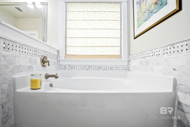 bathroom featuring a washtub