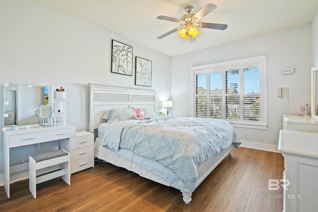 bedroom with ceiling fan and dark wood-type flooring