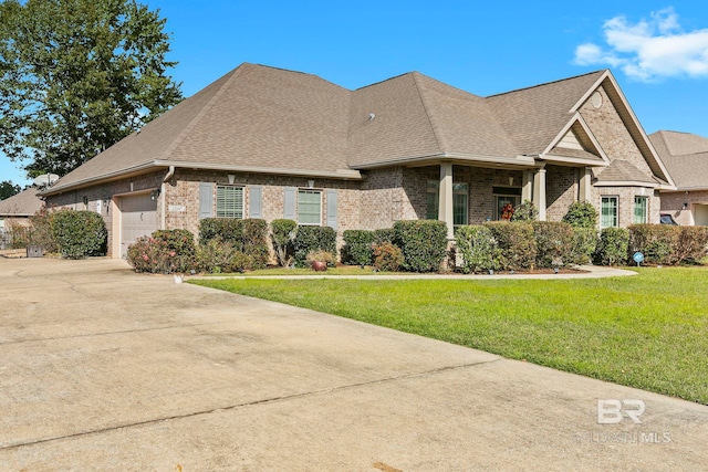 view of front facade with a front yard and a garage