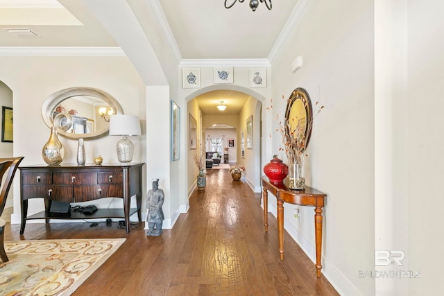 hallway featuring ornamental molding and dark wood-type flooring