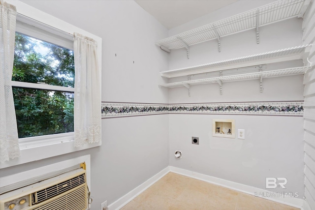 washroom with baseboards, light tile patterned floors, hookup for a washing machine, hookup for an electric dryer, and laundry area