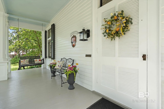 view of patio featuring a porch