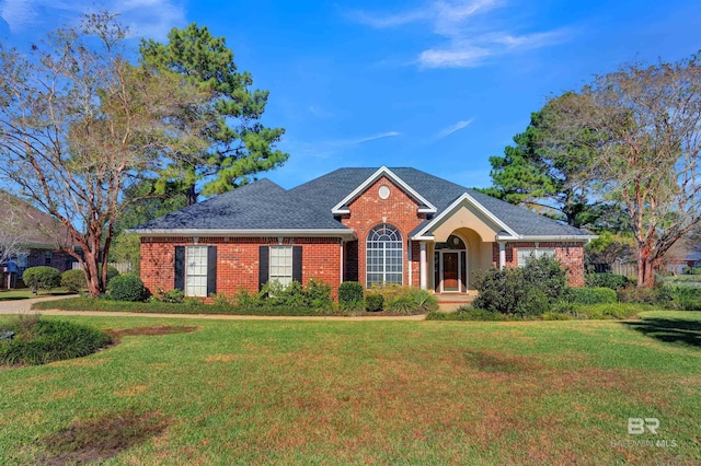 ranch-style house featuring a front lawn