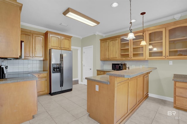 kitchen with kitchen peninsula, stainless steel fridge, decorative light fixtures, light tile patterned floors, and ornamental molding