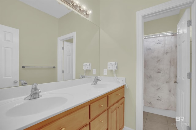 bathroom with tile patterned floors, shower / bathtub combination with curtain, and vanity