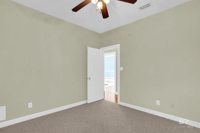 carpeted empty room with ceiling fan