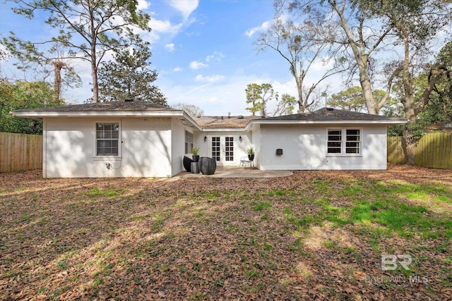 back of house featuring a patio and french doors